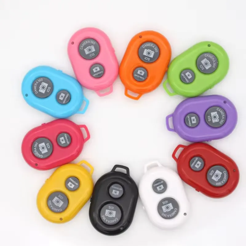 A ring of oval Bluetooth shutter buttons in several colours, each with a camera button and a clip.